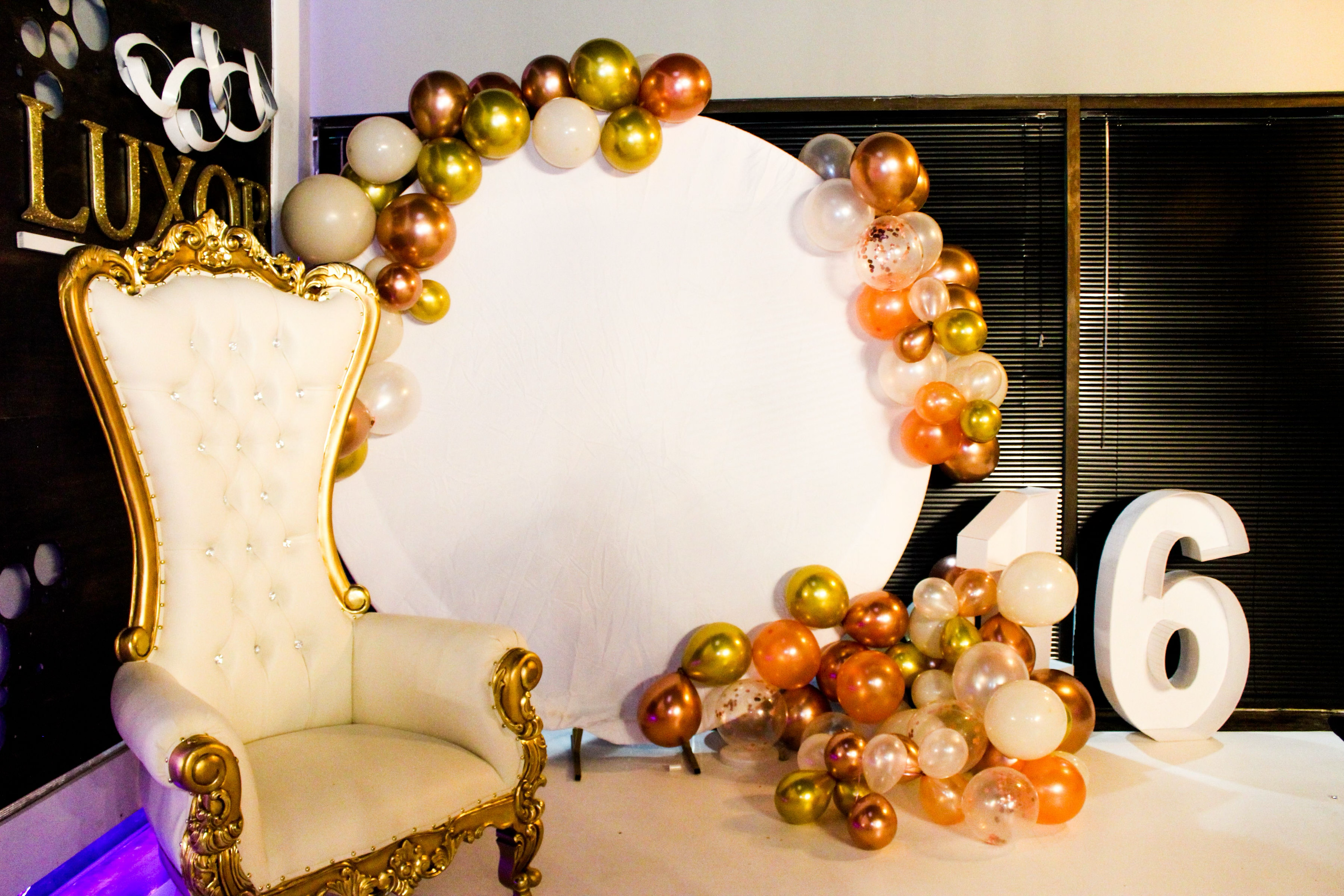 White and gold throne chair styled at an Atlanta event